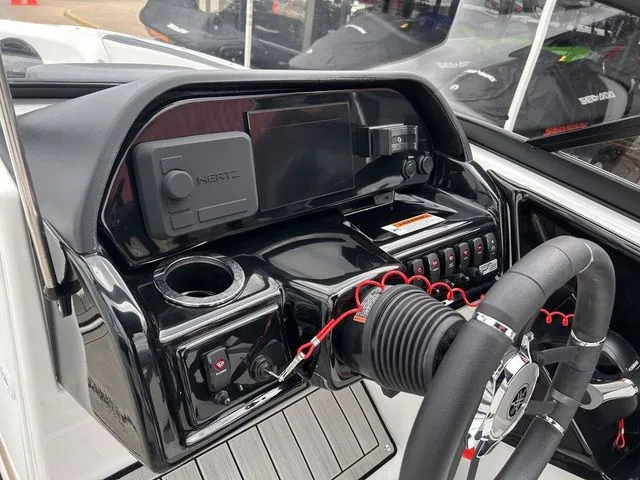 Slide: The Image of Dashboard of 2024 Yamaha Boats 195S with steering wheel and controls. - 12