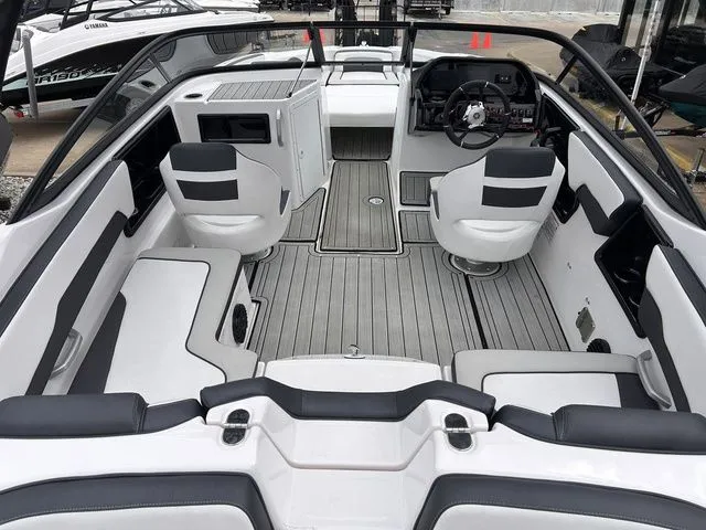 Slide: The Image of Interior of 2024 Yamaha Boats 195S with modern seating and helm console. - 9