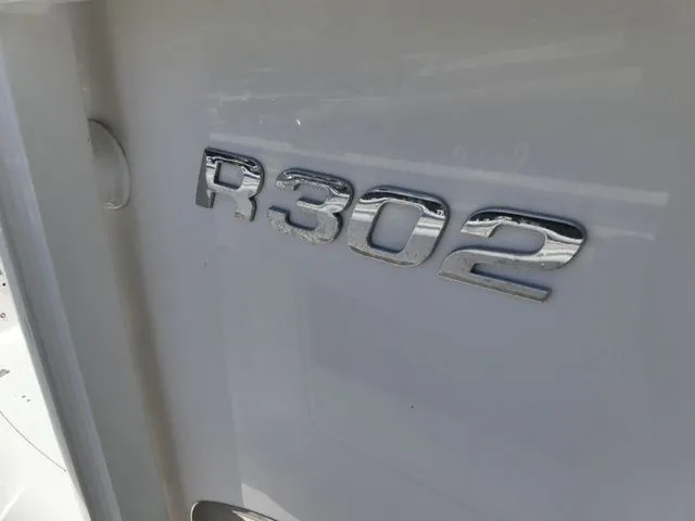 Slide: The Image of Close-up of Robalo R302 Center Console emblem, 2018 model. - 13