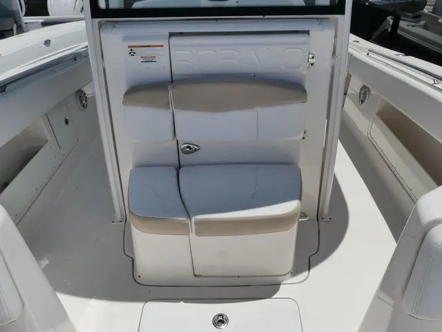 Slide: The Image of 2018 Robalo R302 Center Console, seating area on a boat. - 16