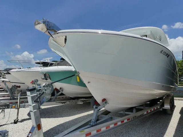 Slide: The Image of 2018 Robalo R302 Center Console on trailer, side view. - 3