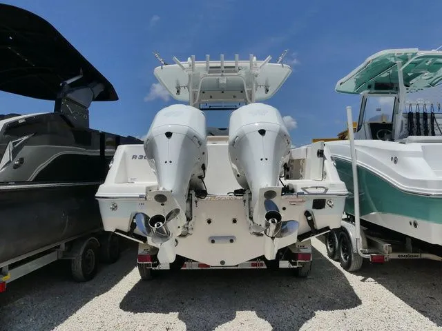 Slide: The Image of 2018 Robalo R302 Center Console boat with dual engines. - 4