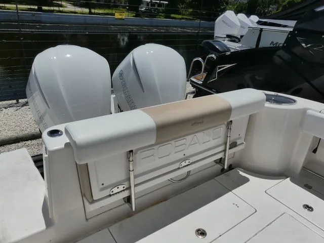 Slide: The Image of 2018 Robalo R302 Center Console with twin outboard engines. - 5