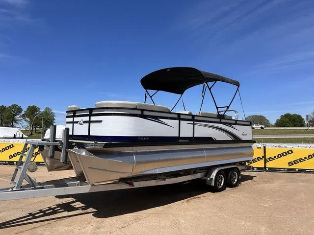 The Image of 2022 Qwest Pontoons 822 LT on trailer, blue sky. - 1