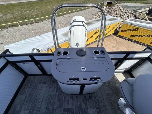 Slide: The Image of 2022 Qwest Pontoons 822 LT helm with controls and seating. - 13