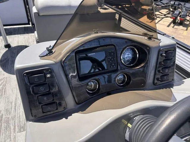 Slide: The Image of Dashboard of a 2022 Qwest Pontoons 822 LT with controls and display. - 17