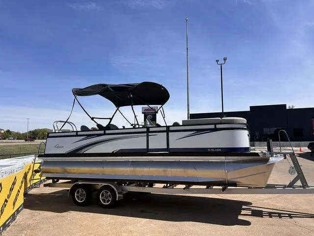 Slide: The Image of 2022 Qwest Pontoons 822 LT on trailer, blue sky. - 7