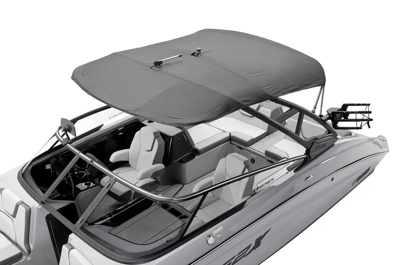 Slide: The Image of Manufacturer Provided Image: 2026 Yamaha Boats 252XE with canopy, sleek design, and spacious seating. - 2