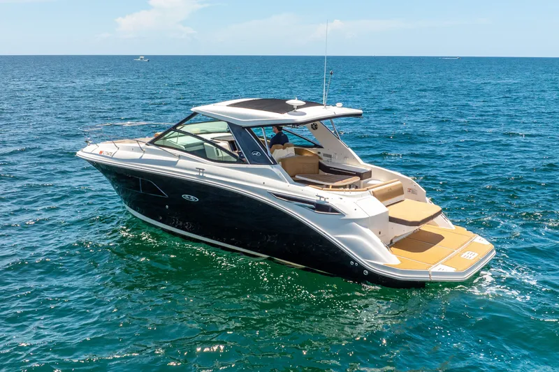 Slide: The Image of 2020 Sea Ray Sundancer 320 on open sea. - 2