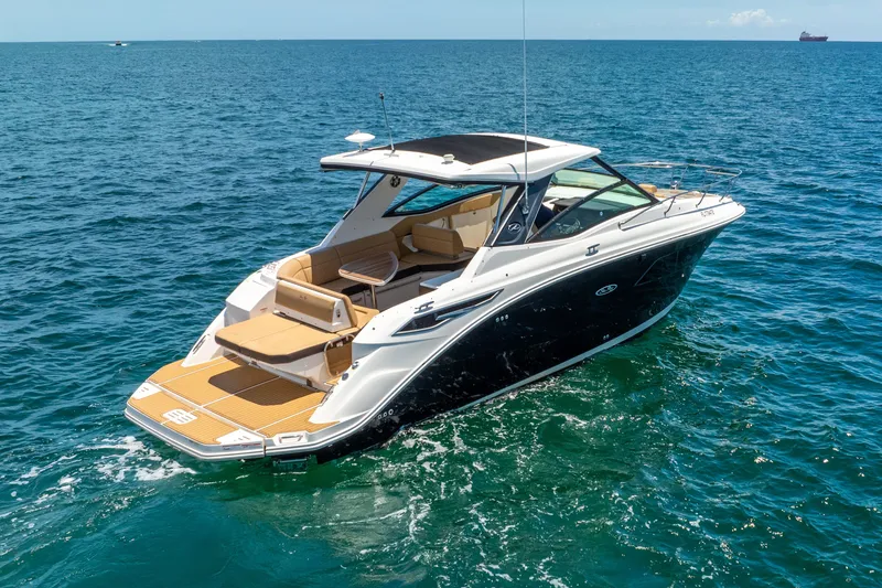 Slide: The Image of 2020 Sea Ray Sundancer 320 on open sea. - 5