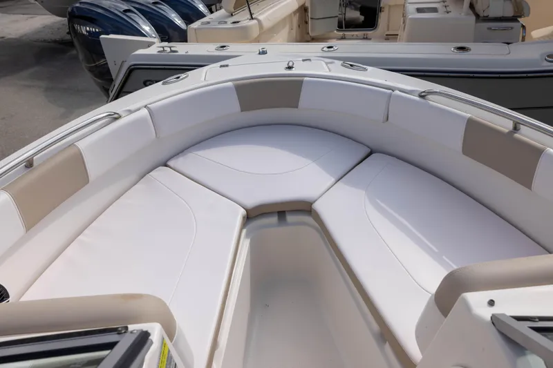 Slide: The Image of 2020 Robalo R227 Dual Console boat with spacious bow seating area. - 14