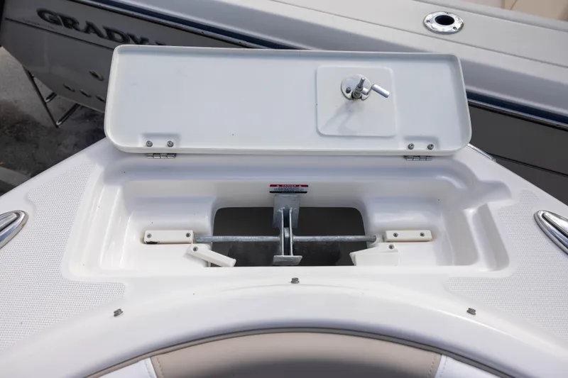 Slide: The Image of Anchor storage compartment on a 2020 Robalo R227 Dual Console boat. - 15