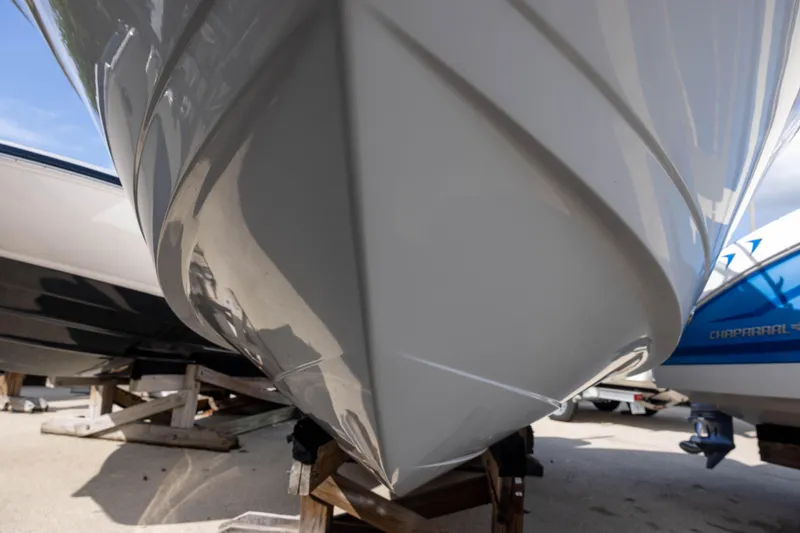 Slide: The Image of 2020 Robalo R227 Dual Console boat hull on display, showcasing sleek design and craftsmanship. - 2