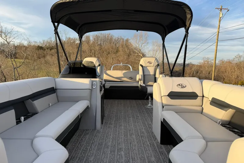 Slide: The Image of Luxurious 2026 Montego Bay ST8524 SB DLX pontoon boat with spacious seating and canopy. - 13