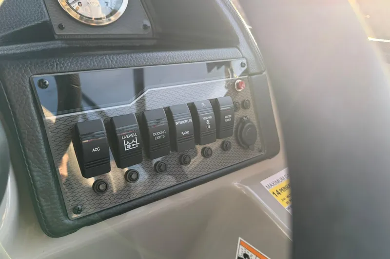 Slide: The Image of Control panel of 2026 Montego Bay ST8524 SB DLX boat with various switches. - 19