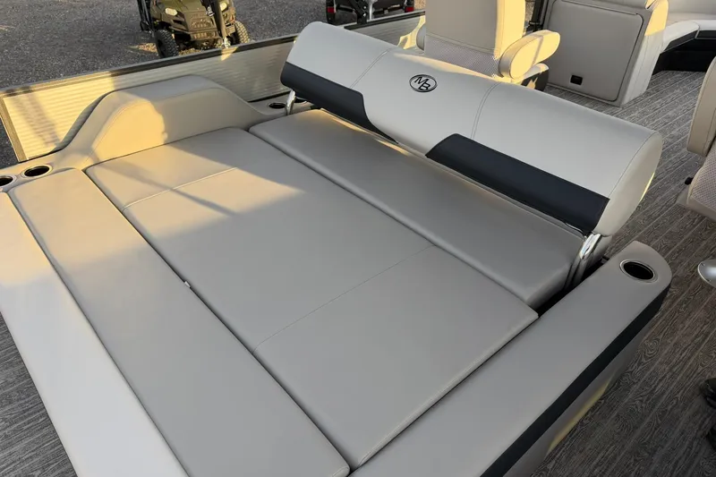 Slide: The Image of Luxurious Montego Bay ST8524 SB DLX 2026 boat interior with comfortable seating and cup holders. - 24