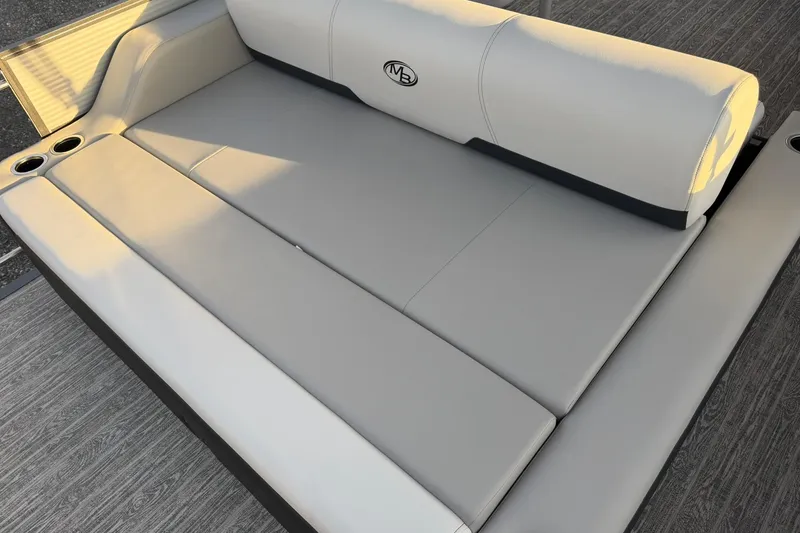 Slide: The Image of Luxurious seating on 2026 Montego Bay ST8524 SB DLX boat with cup holders and sleek design. - 27