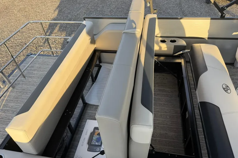 Slide: The Image of 2026 Montego Bay ST8524 SB DLX boat interior with beige seating and cup holders. - 28