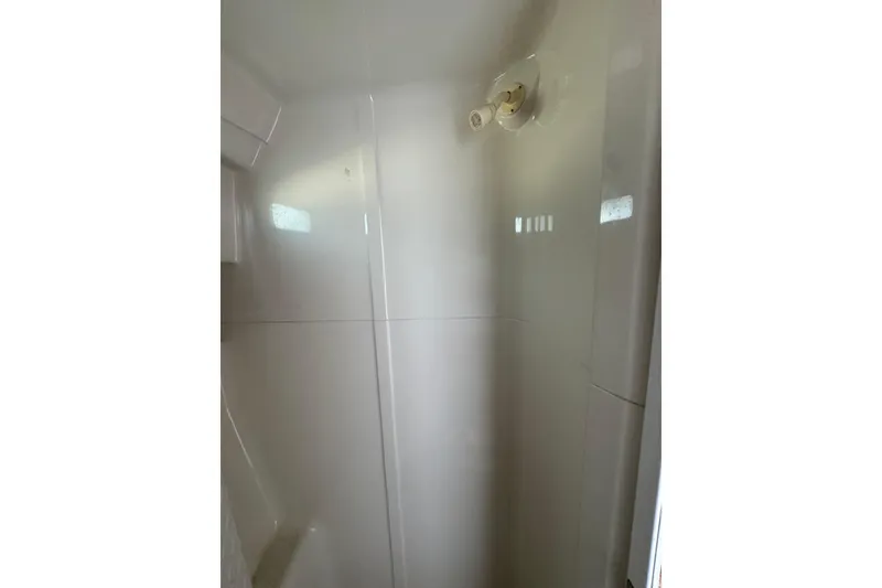 Slide: The Image of Shower area inside a 1995 Silverton 31 Convertible boat. - 23