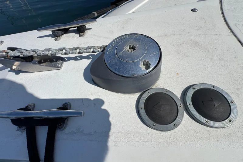 Slide: The Image of Anchor chain and winch on 1995 Silverton 31 Convertible boat deck. - 6