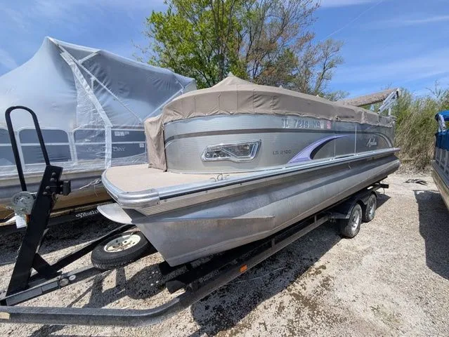 The Image of 2013 Avalon LS Cruise 21' pontoon boat on trailer. - 1