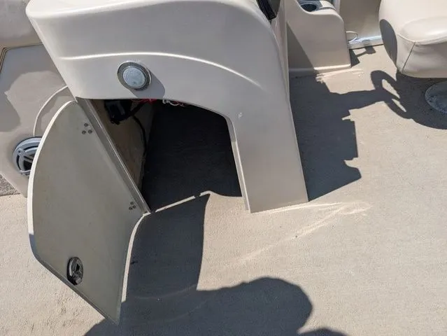 Slide: The Image of Open storage compartment on 2013 Avalon LS Cruise 21' boat. - 10