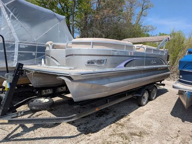 Slide: The Image of 2013 Avalon LS Cruise 21' pontoon boat on trailer. - 3