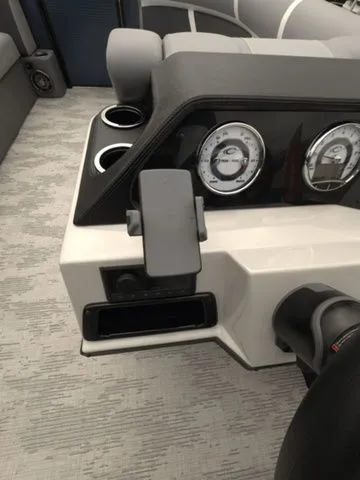Slide: The Image of Dashboard of 2025 Crest Classic 220 SLRC with gauges and cup holders. - 14