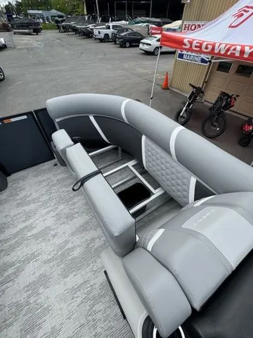 Slide: The Image of Interior of 2025 Crest Classic 220 SLRC pontoon boat with gray upholstery. - 17