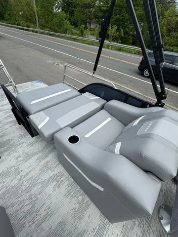 Slide: The Image of 2025 Crest Classic 220 SLRC pontoon boat with gray seating. - 19