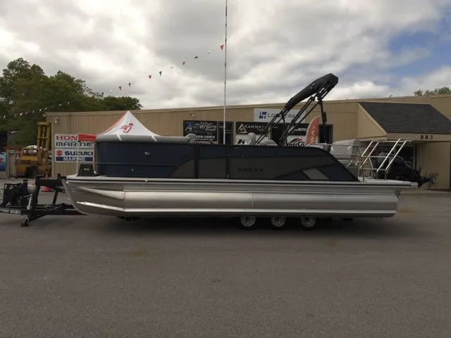Slide: The Image of 2025 Crest Classic 220 SLRC pontoon boat on trailer, 90hp. - 3