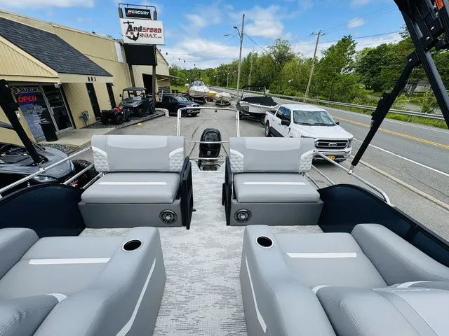 Slide: The Image of 2025 Crest Classic 220 SLRC pontoon boat on a trailer. - 4