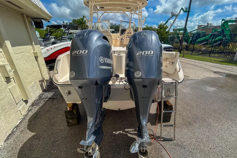 Slide: The Image of 2019 Grady-White Freedom 275 boat with twin Yamaha 200 engines, parked outdoors. - 16