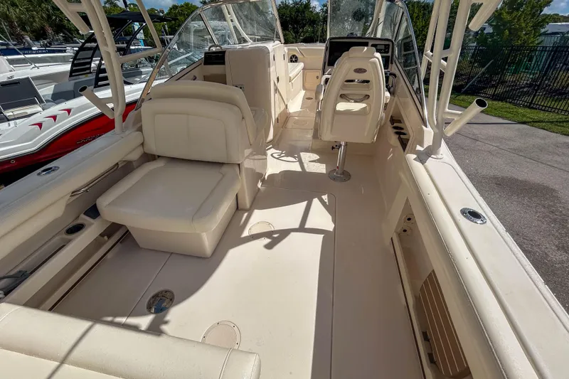 Slide: The Image of 2019 Grady-White Freedom 275 boat interior with seating and helm, showcasing spacious design. - 6