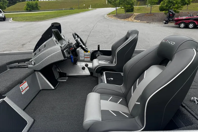 Slide: The Image of 2023 Nitro Z19 boat interior with sleek seats and modern dashboard design. - 10