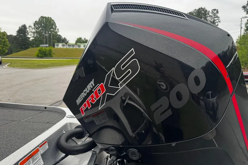 Slide: The Image of 2023 Nitro Z19 boat with Mercury Pro XS 200 engine, parked outdoors. - 12