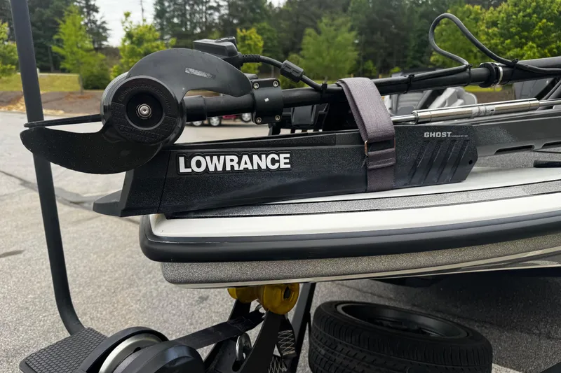 Slide: The Image of Lowrance Ghost trolling motor on 2023 Nitro Z19 boat, parked outdoors. - 4
