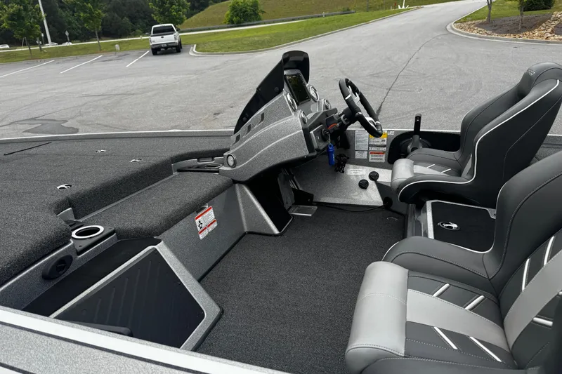 Slide: The Image of Interior of a 2023 Nitro Z19 boat with modern seating and dashboard. - 9