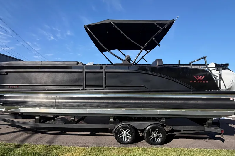 The Image of 2026 Whisper C25 Splash Pad pontoon boat with sleek black design and canopy. - 0
