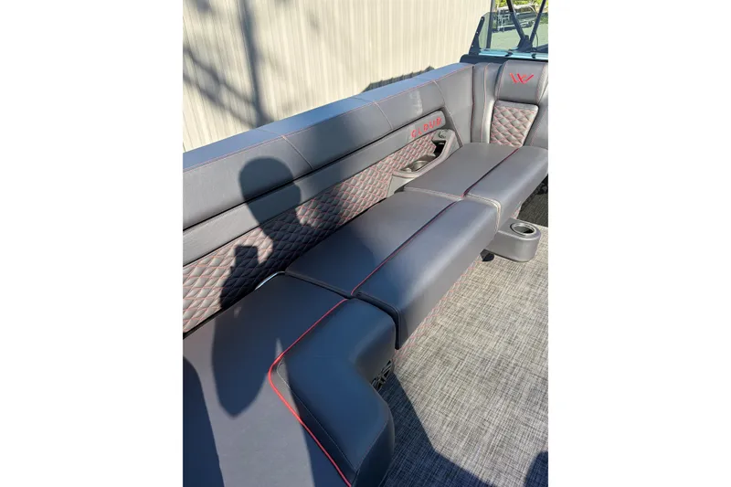 Slide: The Image of Luxurious seating in 2026 Whisper C25 Splash Pad boat with quilted upholstery and cup holder. - 15