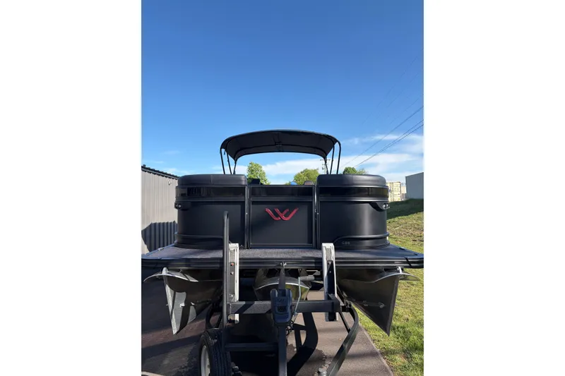 Slide: The Image of 2026 Whisper C25 Splash Pad boat with sleek black design and modern features. - 21