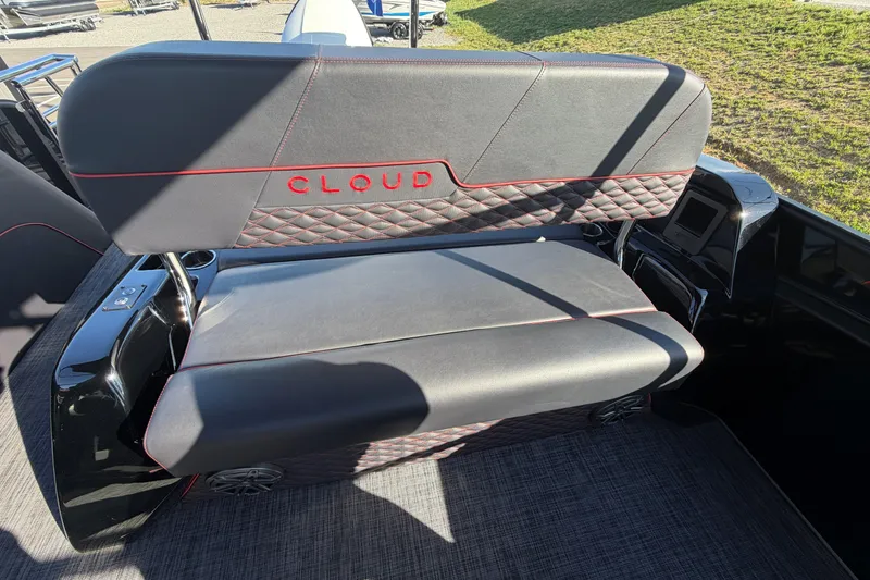 Slide: The Image of Luxurious seating on Whisper C25 Splash Pad 2026 boat, featuring sleek design and red stitching. - 7