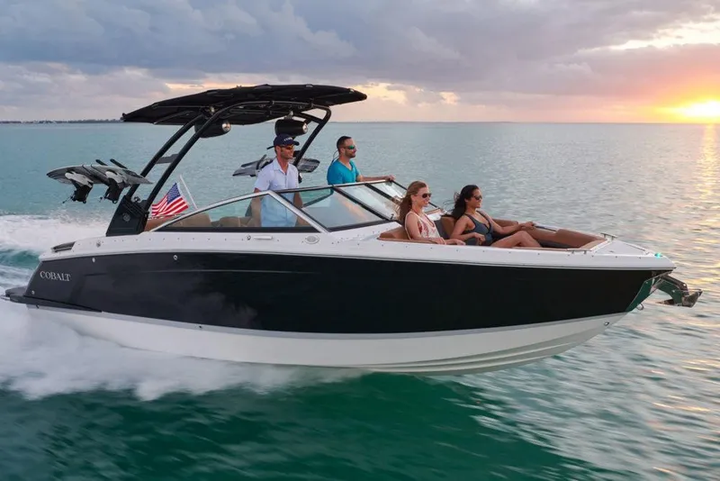 Slide: The Image of Manufacturer Provided Image: 2025 Cobalt R6 boat cruising at sunset with passengers enjoying the ride. - 11