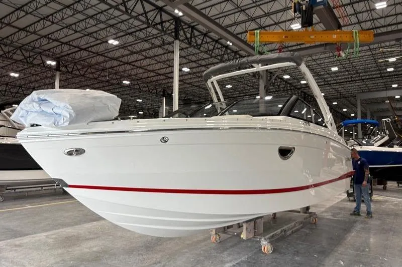 Slide: The Image of 2025 Cobalt R6 boat in a factory setting, showcasing sleek design and modern features. - 4