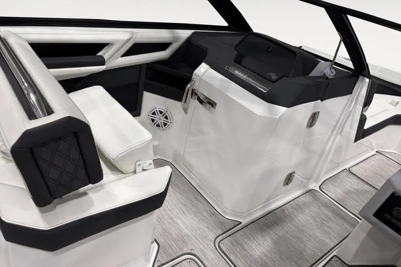 Slide: The Image of Interior of 2025 Cobalt R6 boat featuring sleek white and black seating and modern design. - 8
