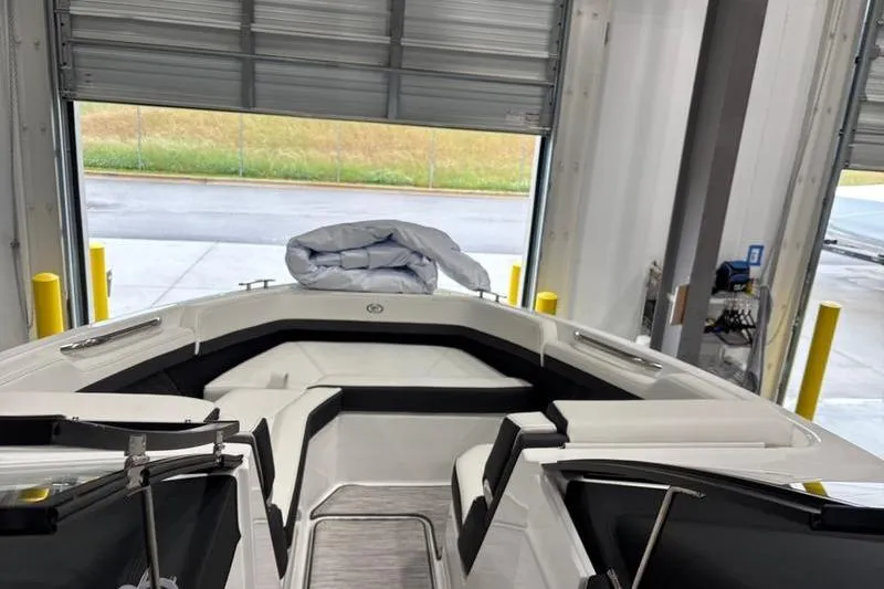 Slide: The Image of 2025 Cobalt R6 boat interior in a garage, featuring sleek seating and modern design. - 9