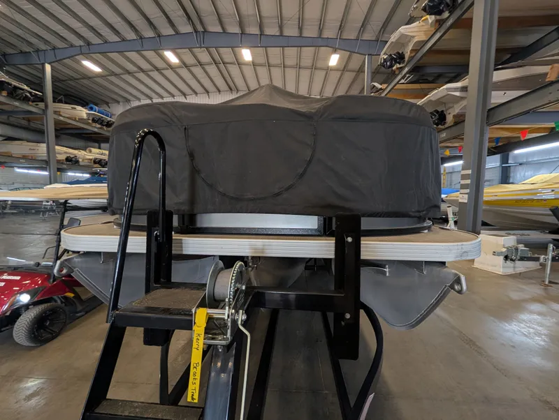 Slide: The Image of 2021 Veranda pontoon boat in storage with cover. - 13