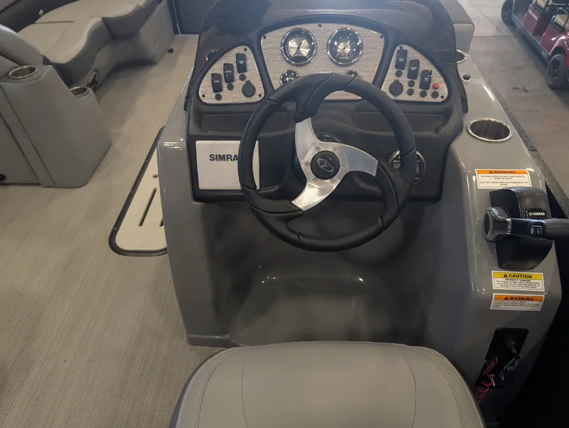 Slide: The Image of Interior view of a 2021 Veranda pontoon boat with steering console. - 17