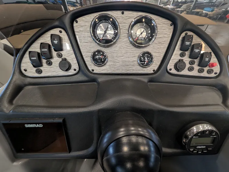 Slide: The Image of Dashboard of a 2021 Veranda pontoon boat with instruments. - 18