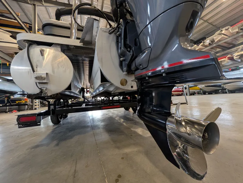 Slide: The Image of 2021 Veranda pontoon with outboard motor in a storage facility. - 27